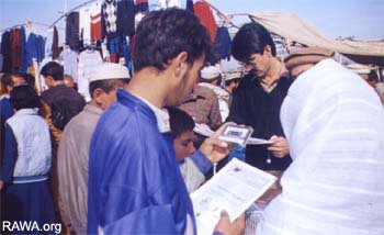 RAWA members sell their publications in Sunday Bazzar in Peshawar